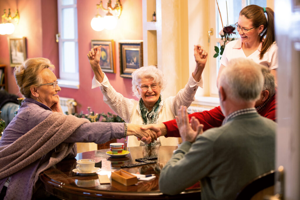 Retirement home occupants sitting at the table together